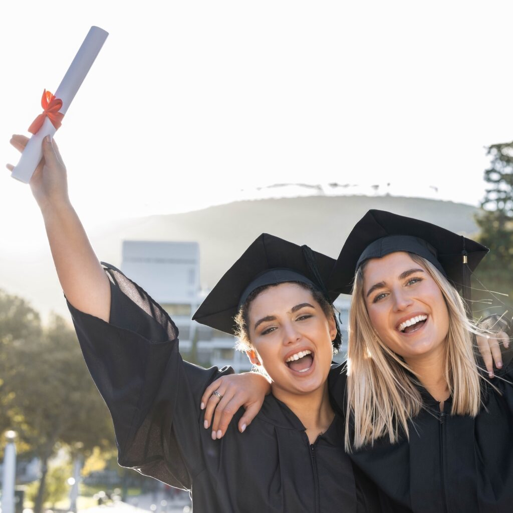 Graduation, celebration and portrait of women cheering for scholarship success. Happy female studen