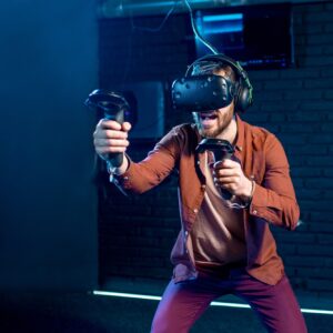 Man playing game with virtual reality headset in the club