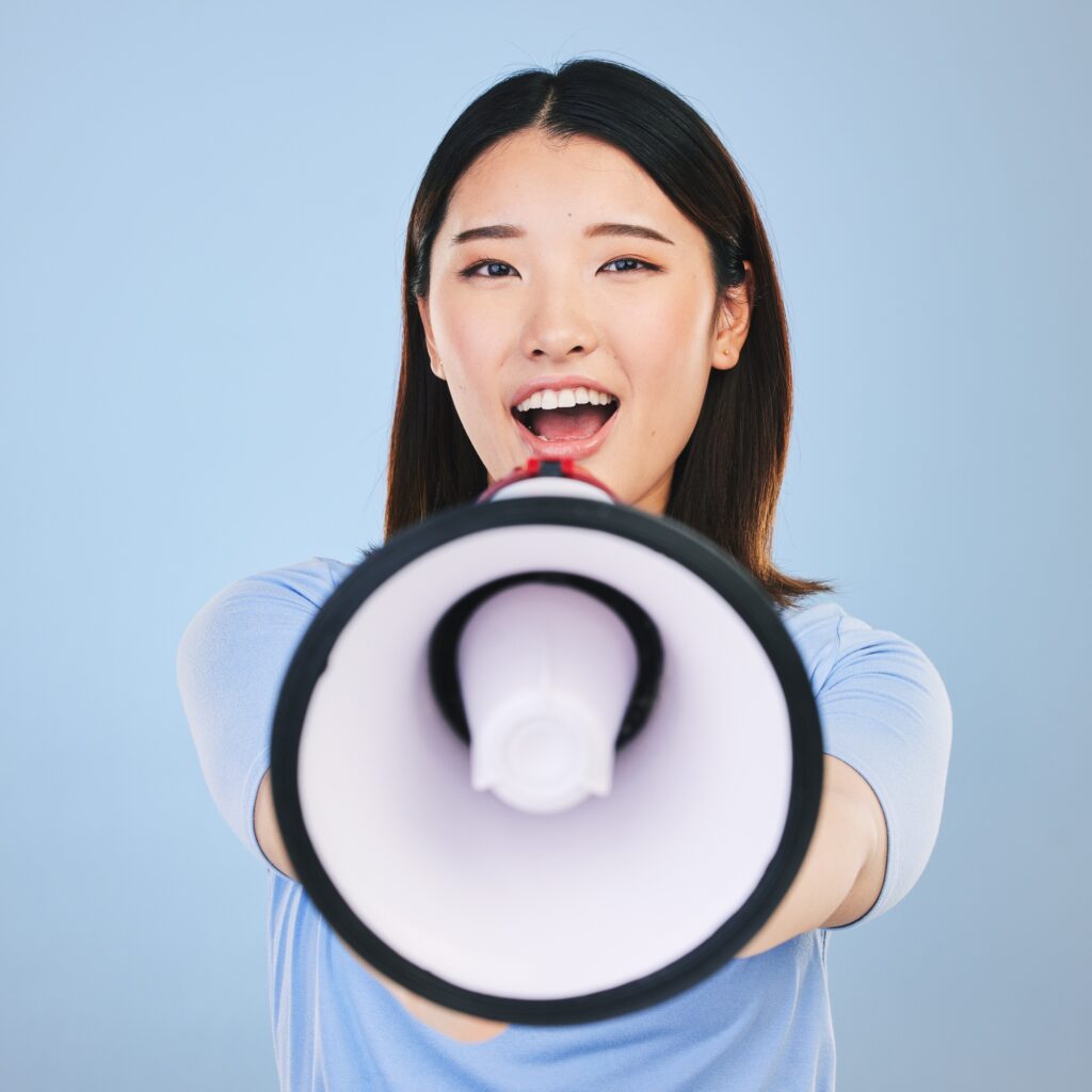 Woman, megaphone and voice for announcement, broadcast or student news and sale on blue background.